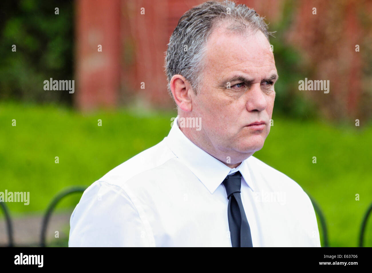 Belfast, Northern Ireland. 13 August 2014. Paul Duffy attends the paramilitary funeral of veteran IRA volunteer Tony Catney Credit: Stephen Barnes/Alamy Live News Stock Photo