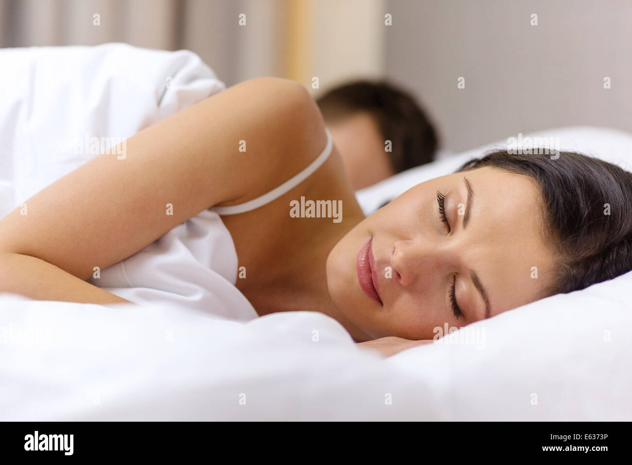 happy couple sleeping in bed Stock Photo - Alamy