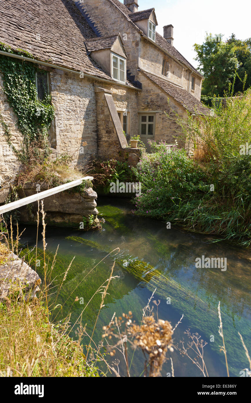 The River Windrush at Windrush Mill in the Cotswold village of Windrush, Gloucestershire UK Stock Photo