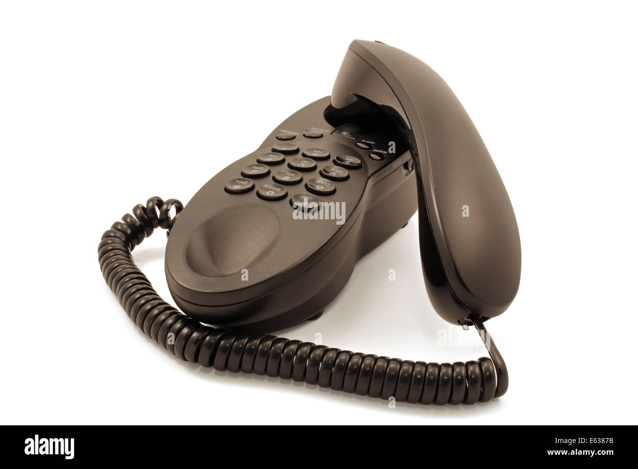 Closeup of a black corded telephone against a white background Stock Photo