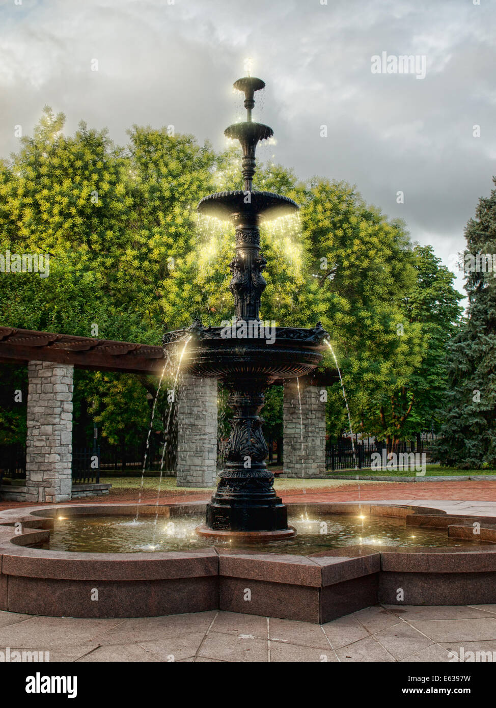 ornate fountain with sparkling water Stock Photo Alamy