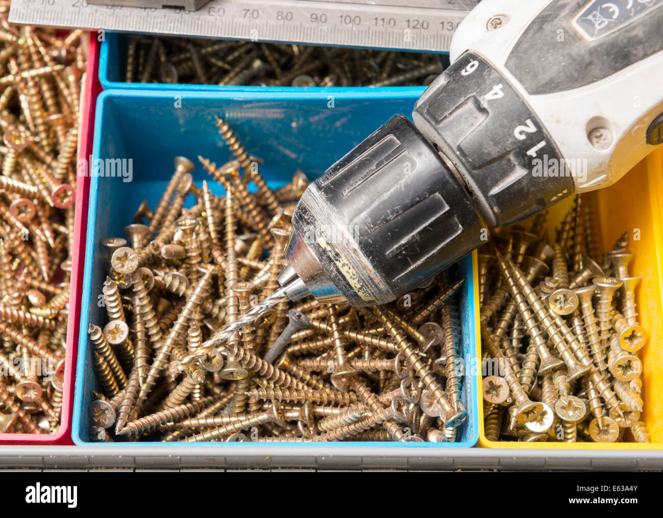 Boxes of screws and a power drill Stock Photo Alamy