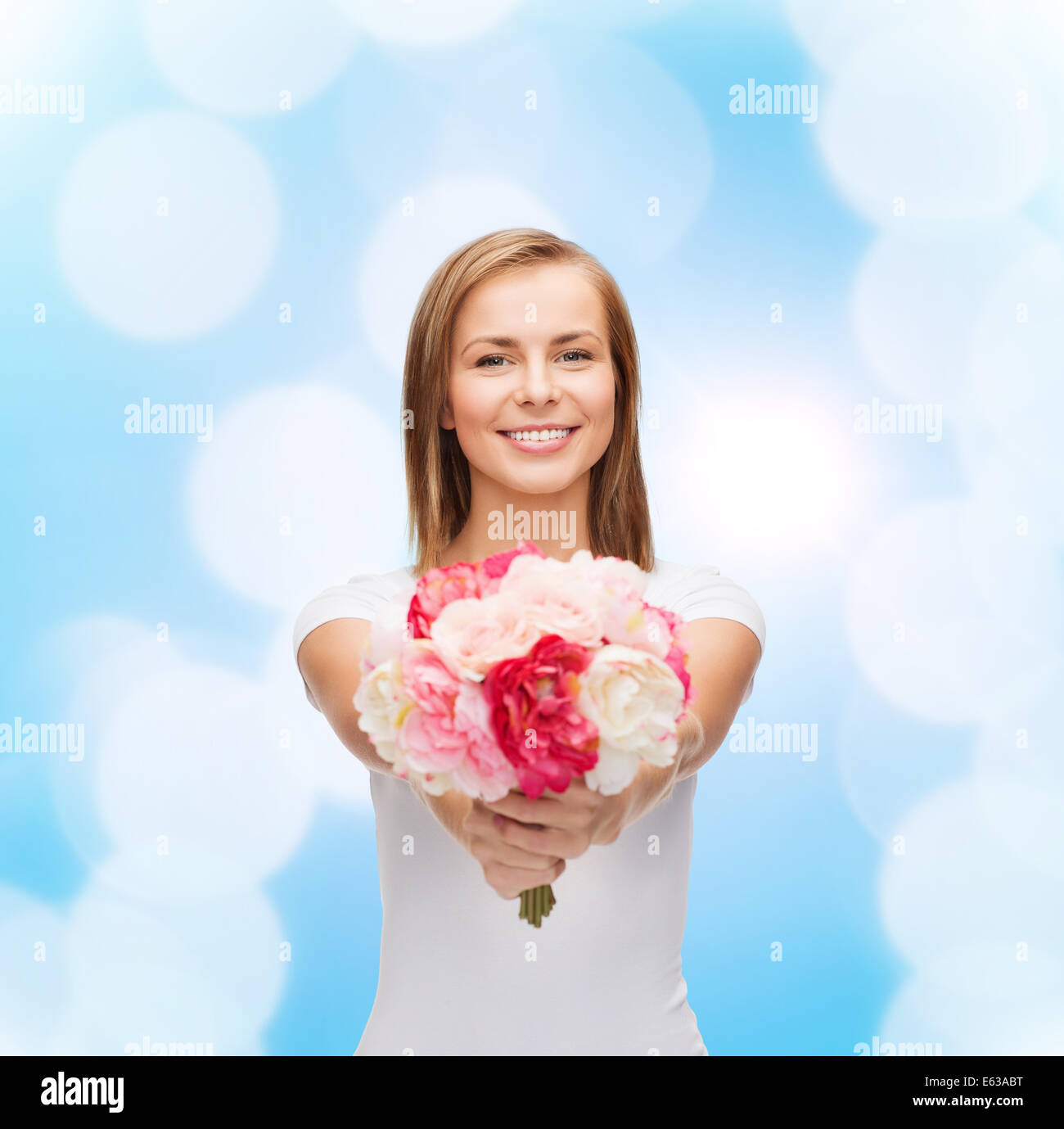 smiling woman with bouquet of flowers Stock Photo - Alamy