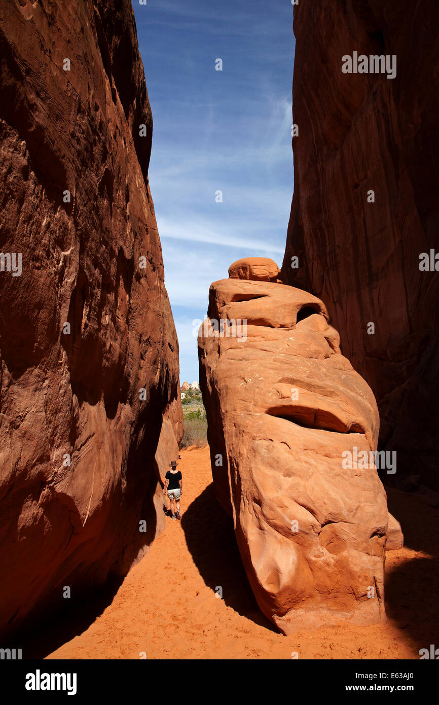 Hiker on sandy track to Sand Dune Arch, Arches National Park, near Moab, Utah, USA Stock Photo