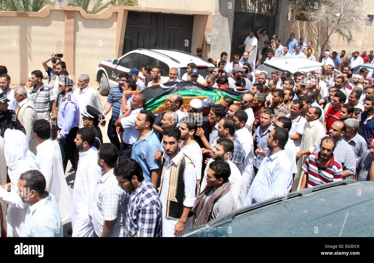 Tripoli. 13th Aug, 2014. People attend the funeral of Colonel Mohammed