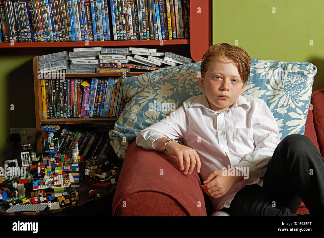 Schoolboy home alone after school Stock Photo