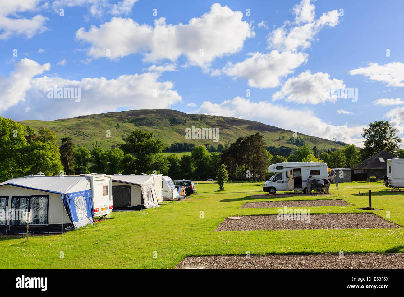 Motorhomes camped on a quiet caravan site in evening sun in early summer. Blair Atholl, Perth and Kinross, Scotland, UK, Britain Stock Photo