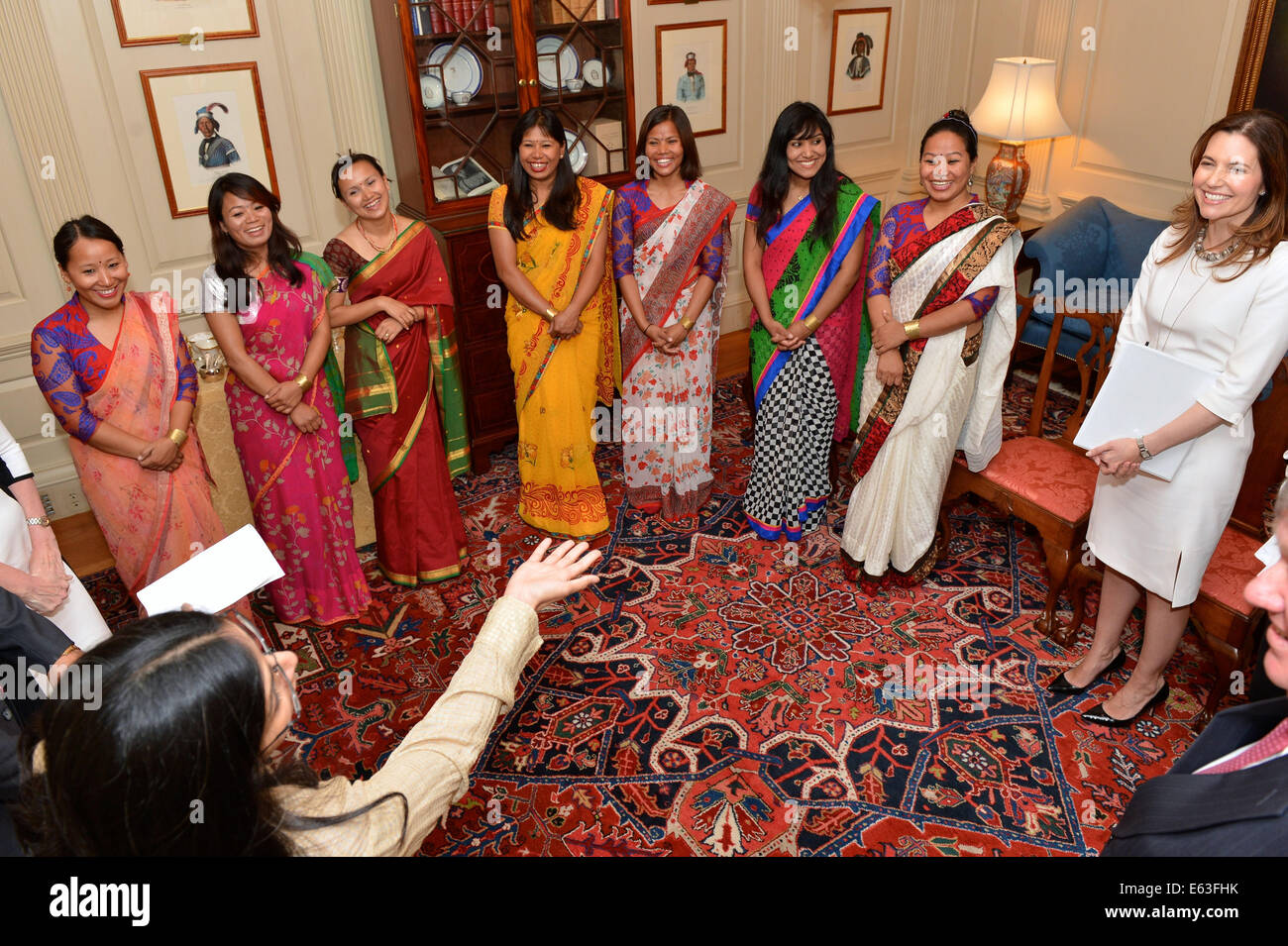 With Assistant Secretary of State for Educational and Cultural Affairs Evan Ryan looking on, right, Assistant Secretary of State for South and Central Asian Affairs Nisha Biswal speaks with seven women mountain climbers from Nepal at the U.S. Department o Stock Photo