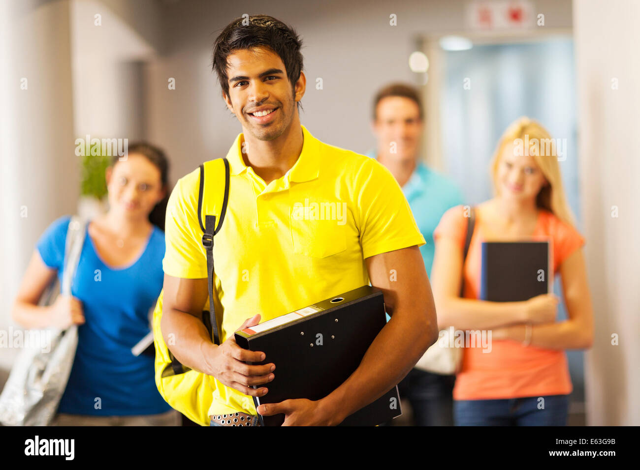 happy male college student and friends on campus Stock Photo - Alamy