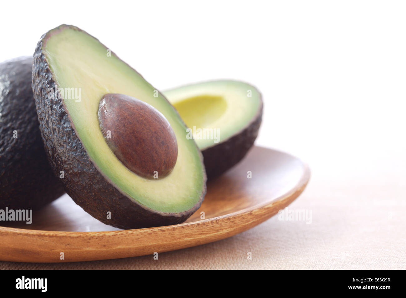 Avocado halves on a plate Stock Photo