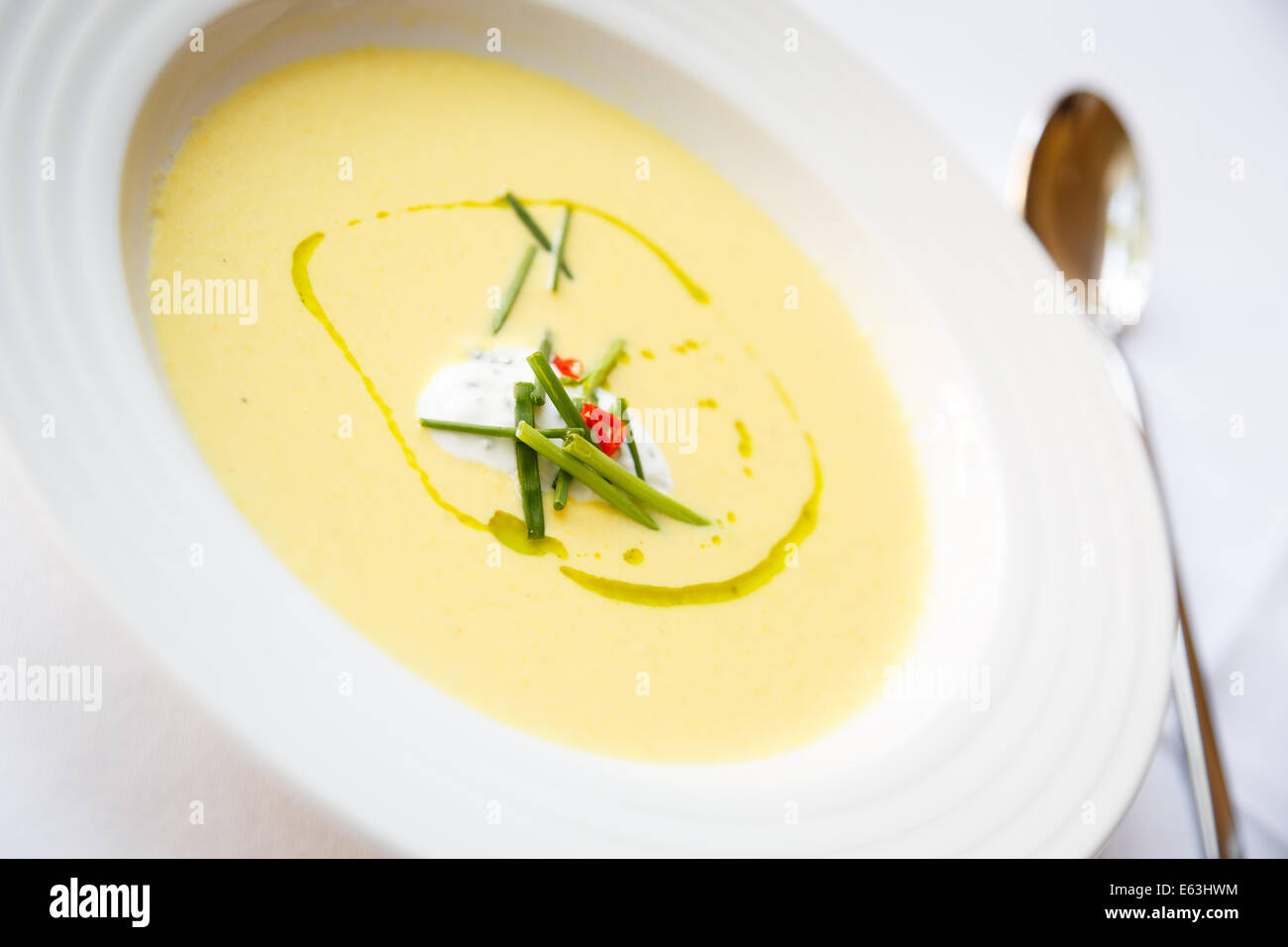 Creamy corn soup with chili pepper Stock Photo - Alamy