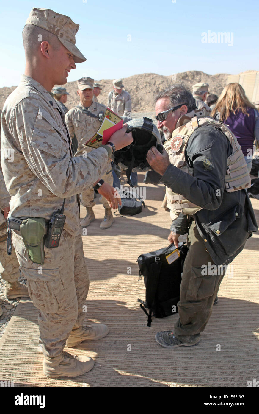 Academy Award winning actor and comedian Robin Williams greets U.S. Marines during the 2010 USO Holiday Tour December 16, 2010 in Marjah, Helmand province, Afghanistan. Stock Photo