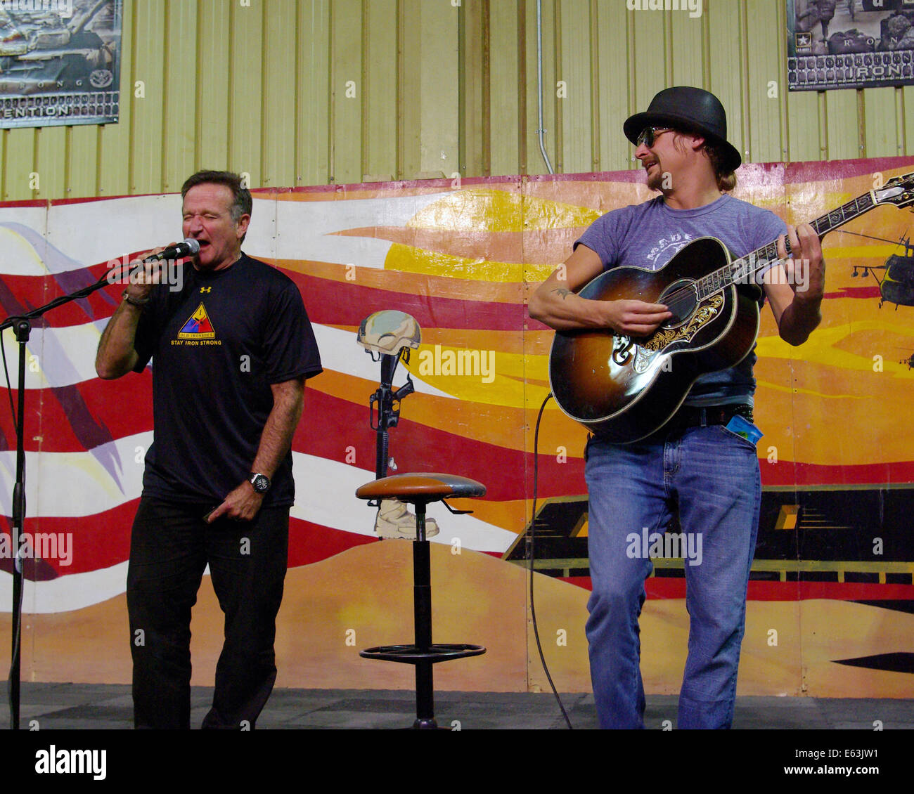 Actor and comedian Robin Williams, left, and rock musician Kid Rock perform for American troops at contingency operating base Speicher during the 2007 USO Christmas Tour December 19, 2007 in Tikrit, Iraq. Stock Photo