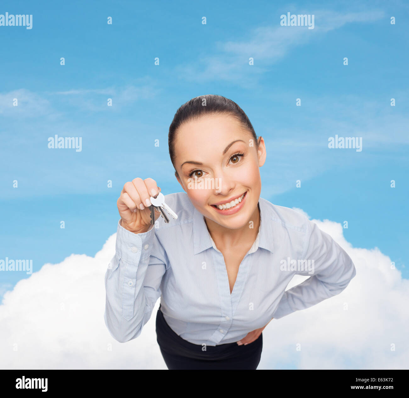 smiling businesswoman with house keys Stock Photo - Alamy