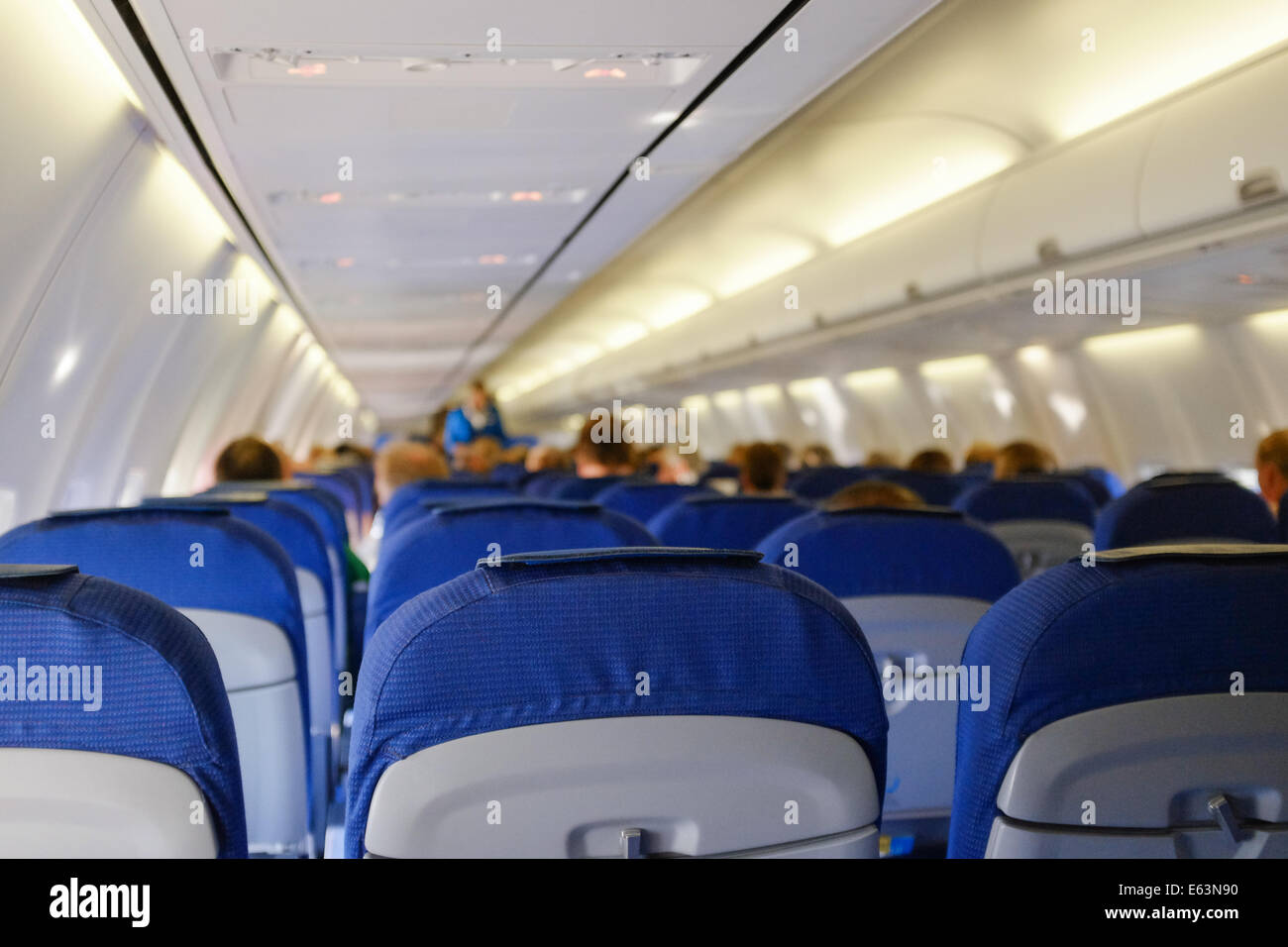 Inside of an airplane from KLM, a Boeing 737, with blurred background. Stock Photo
