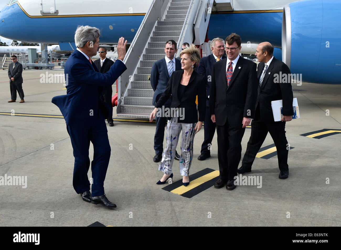 U.S. Secretary of State John Kerry waves goodbye to Australian Foreign Minister Julie Bishop, U.S. Ambassador to Australia John Stock Photo