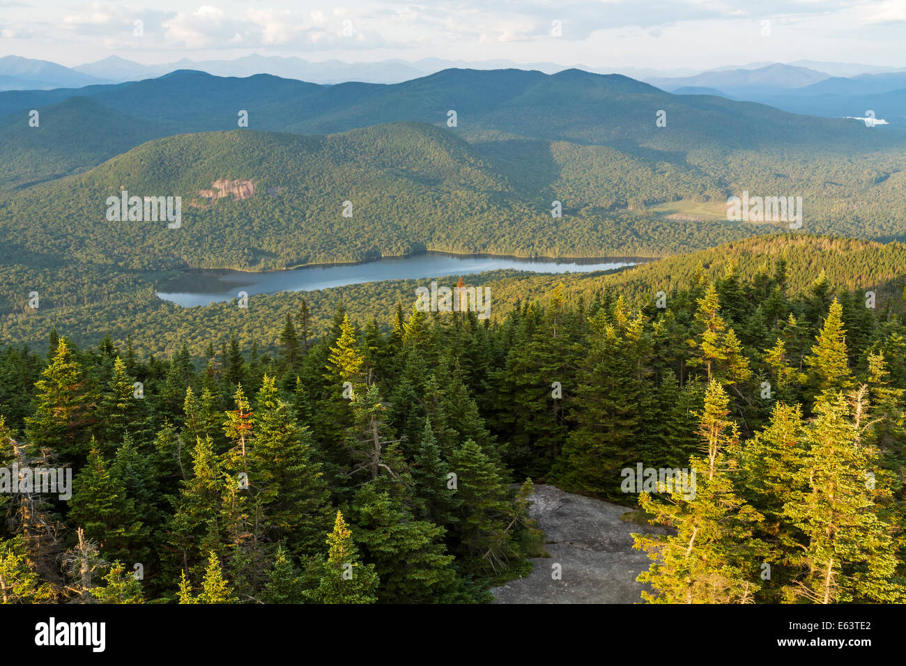 Tirrell Pond and the cliffs of Tirrell Mountain seen from the Blue Mountain fire tower in the Adirondacks Mountains of New York Stock Photo