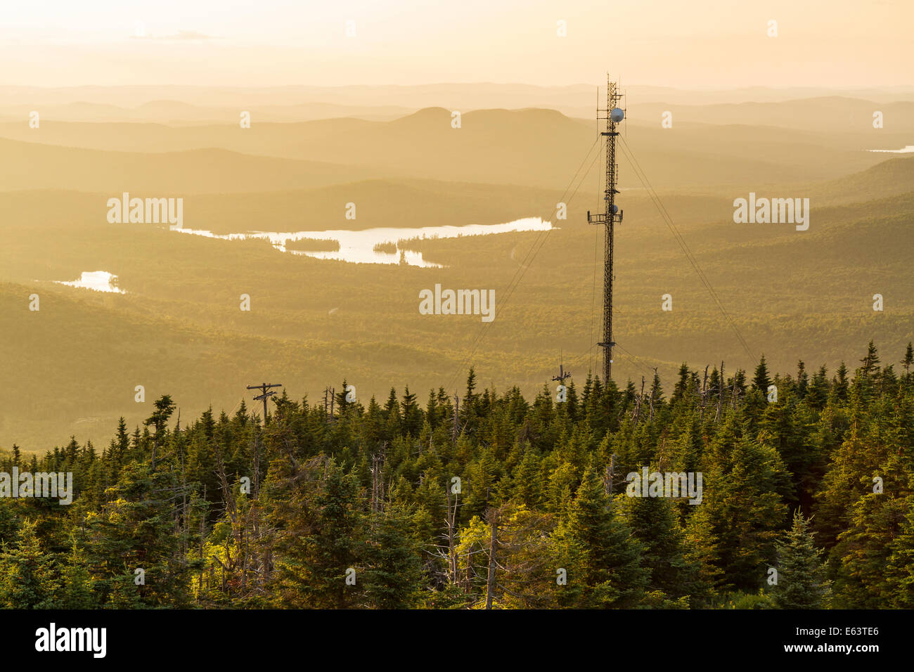 The radio tower on Blue Mountain silhouetted against the sunset in the Adirondacks Mountains of New York Stock Photo