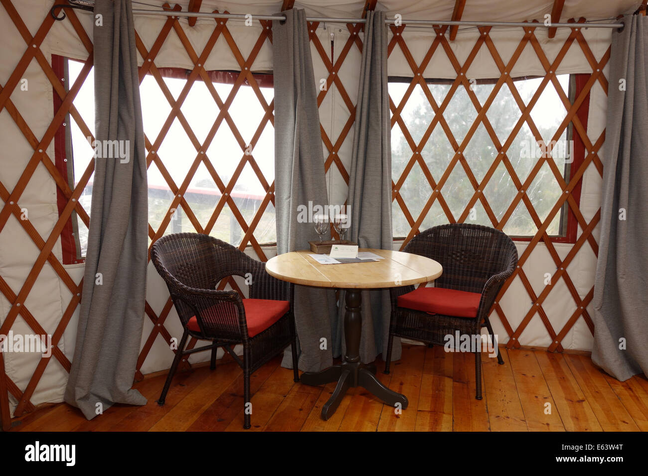 Treebones Resort is a 'glamping' campground in Big Sur, California. View of inside the luxury yurt dining area. Stock Photo
