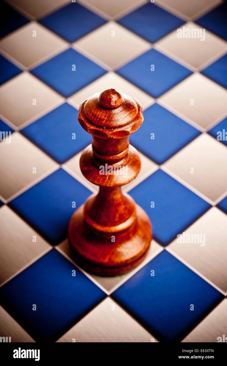 Queen chess piece on a chessboard Stock Photo Alamy
