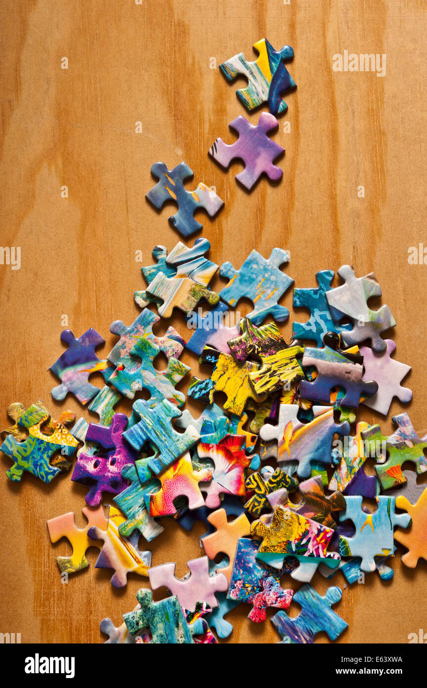 jigsaw puzzle pieces scattered Stock Photo