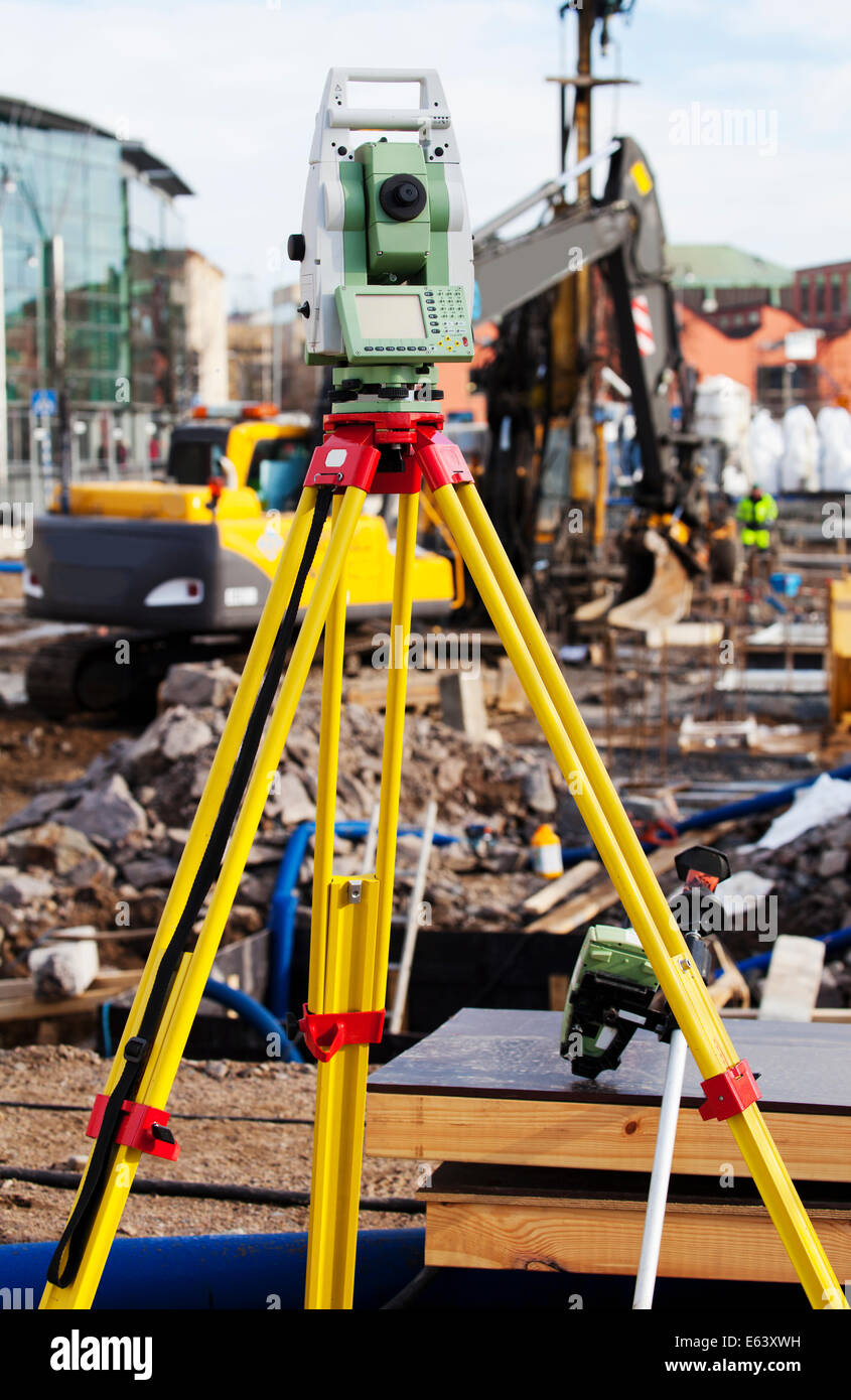 surveyors measuring instrument inside construction plant Stock Photo