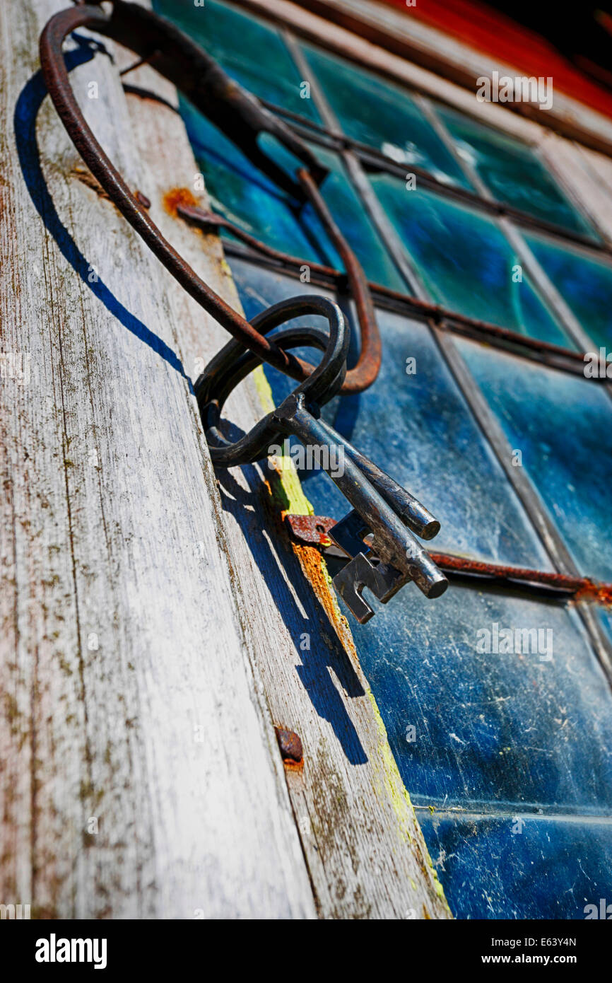 old keys and ring against stained glass and windows Stock Photo