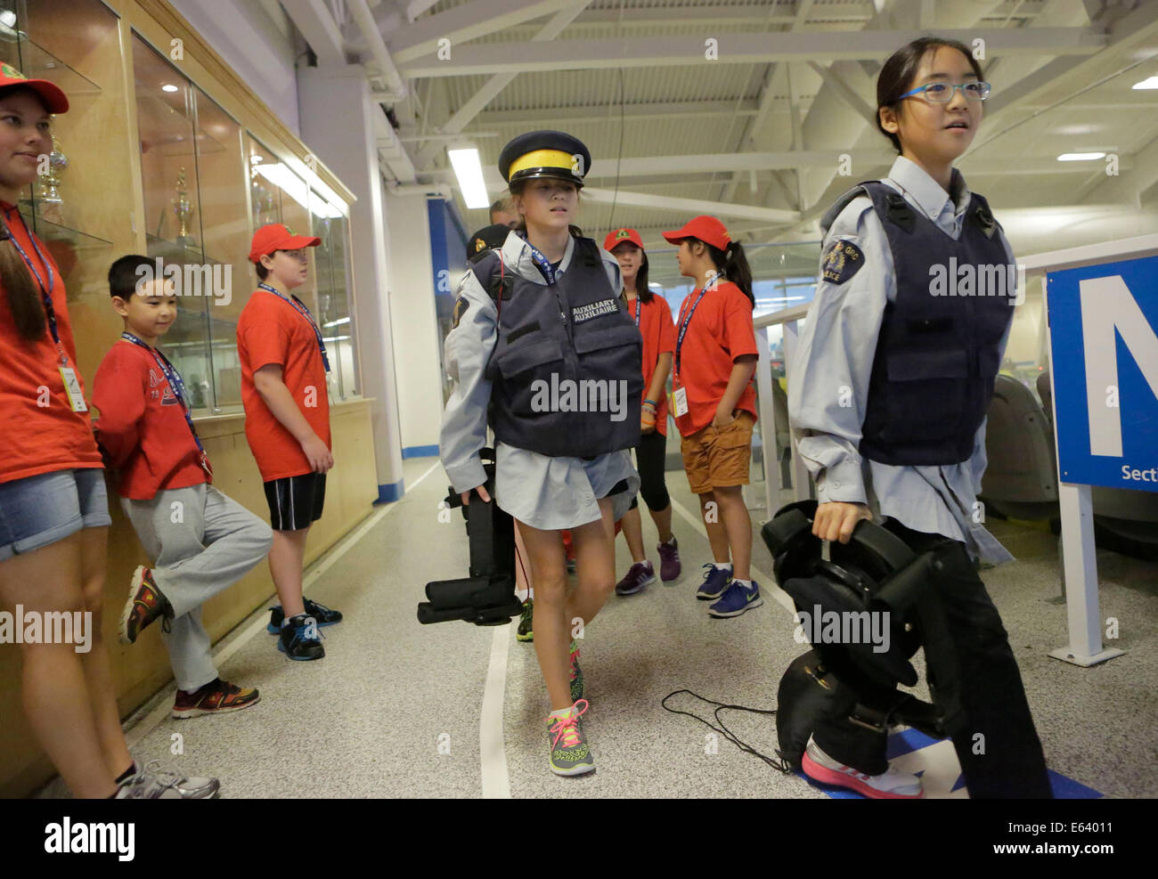 Coquitlam, Canada. 13th Aug, 2013. Students put on police uniforms and
