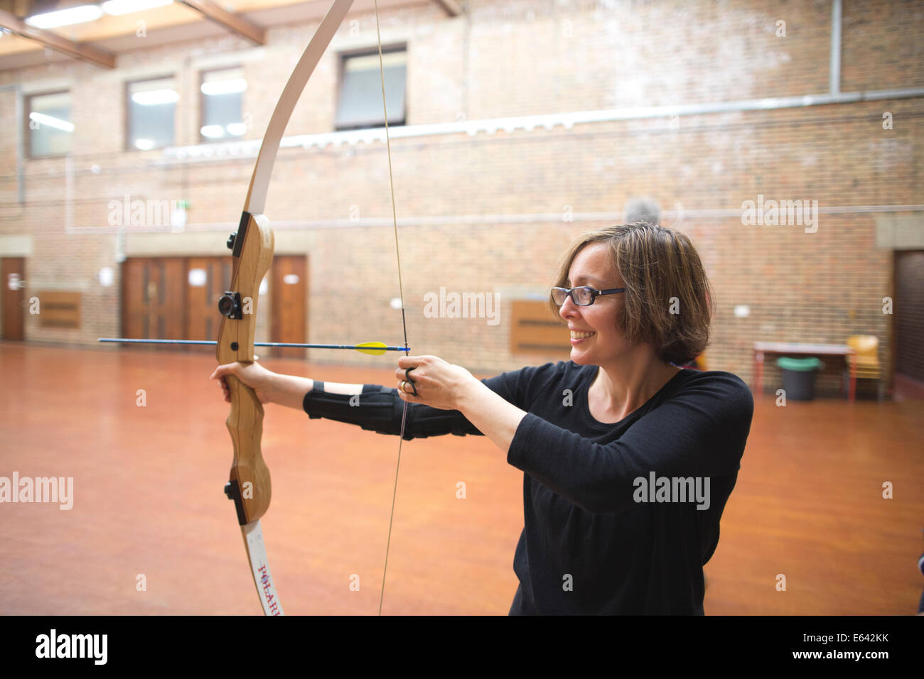 Indoor archery lesson at 'Experience Archery' in London, England, UK