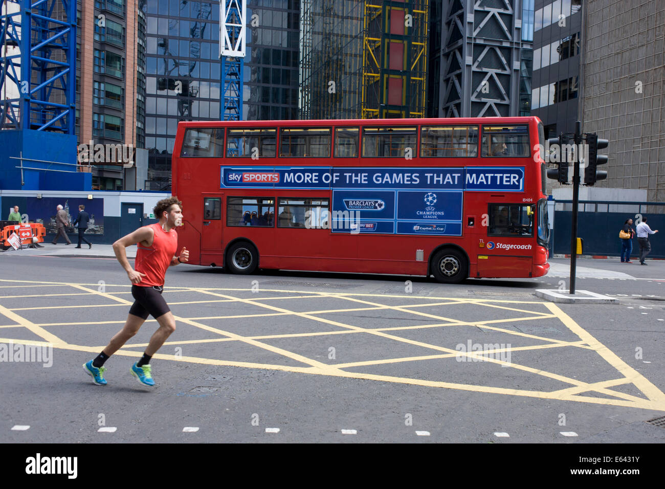A mid-afternoon jogger runs over the junction of Bishopsgate as a ...
