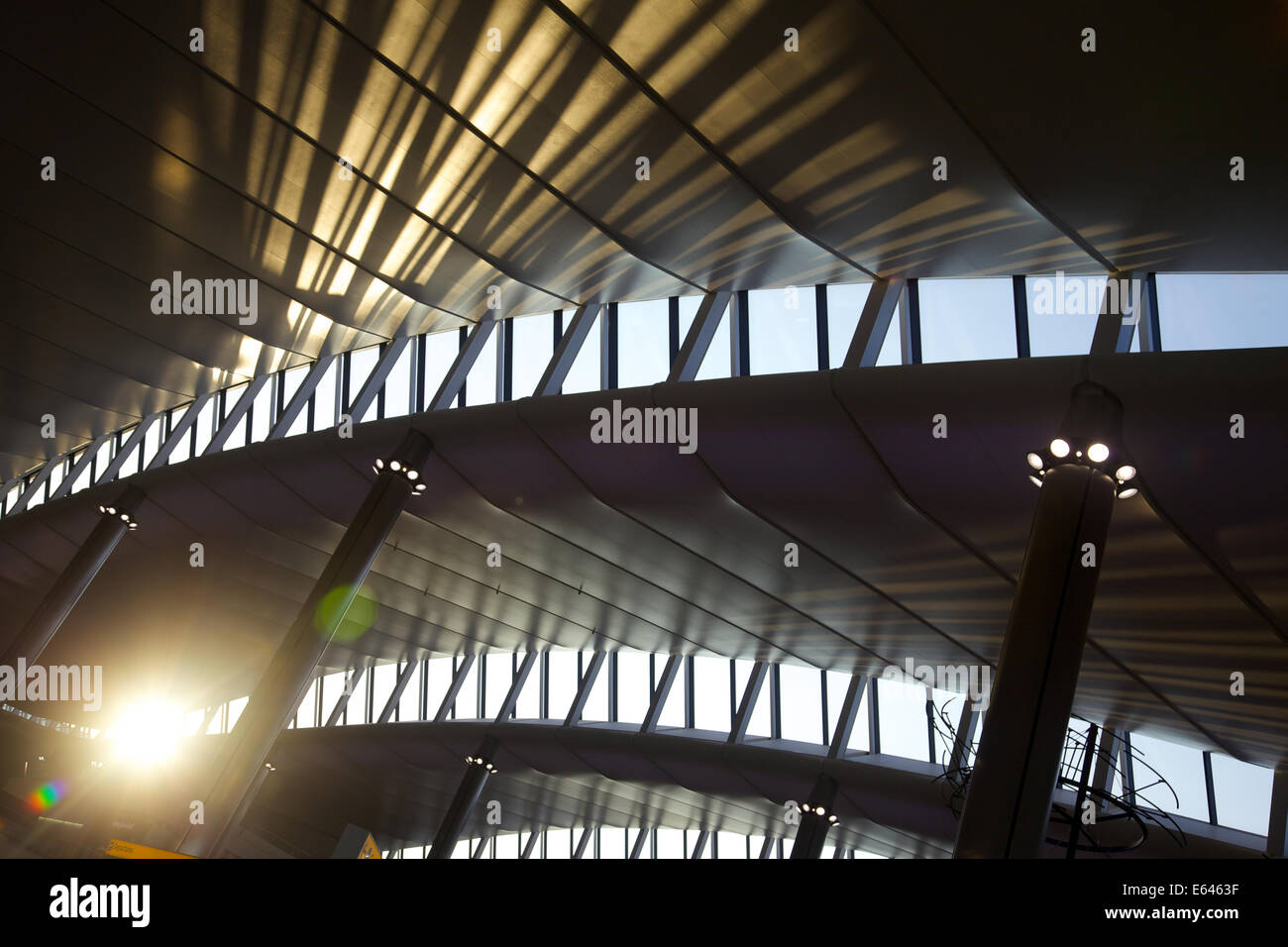 The sun shinning on the roof and windows of the new terminal 2 building at Heathrow airport , London Stock Photo