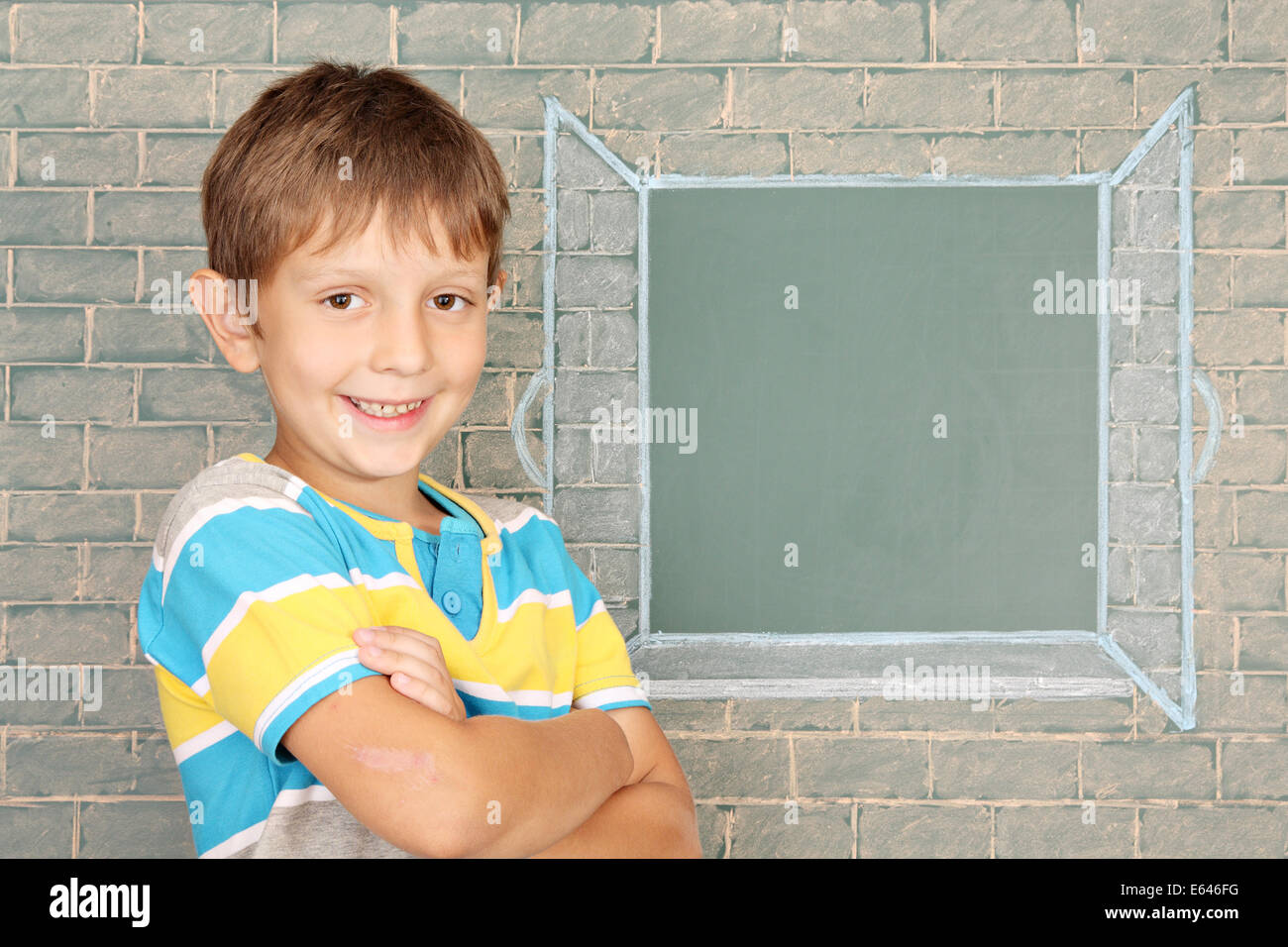 Schoolboy before the open window represented on a chalkboard Stock Photo