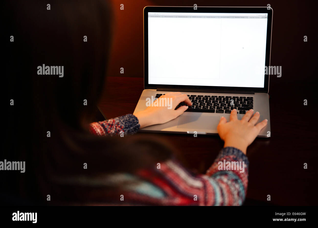 Back view portrait of a woman using laptop Stock Photo - Alamy