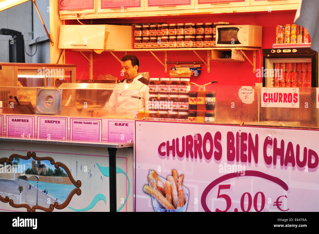 PARIS, FRANCE - MARCH 30, 2011: Traditional churros and crepes for sale in Paris Stock Photo