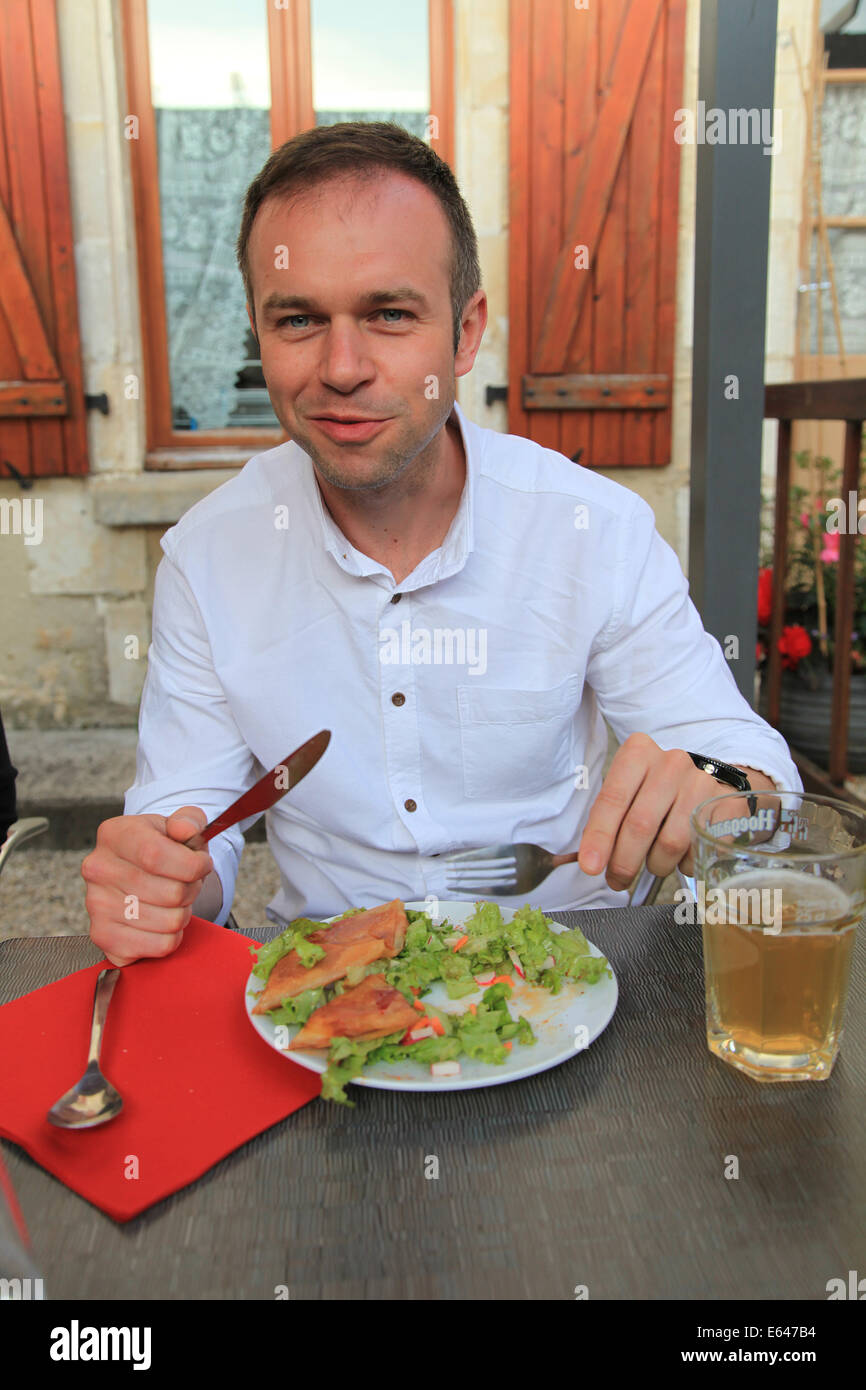 Man eating dinner Stock Photo