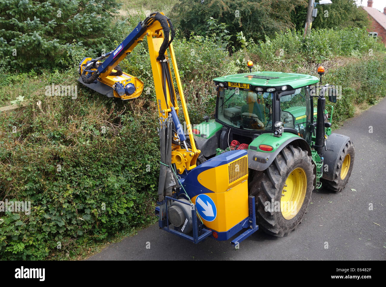 Tractor hedge cutting cutter Uk Stock Photo