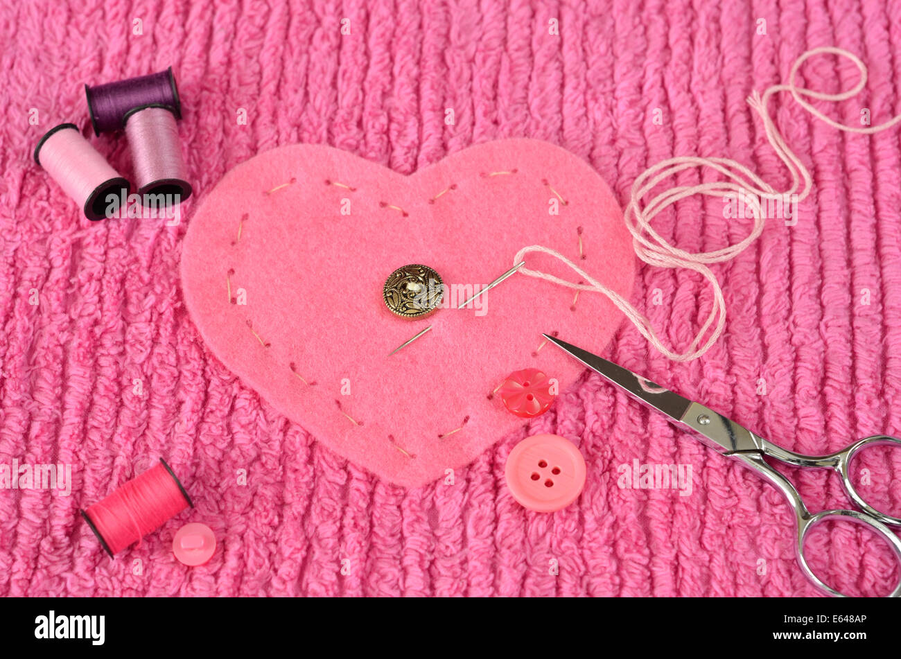 Sewing button heart hi-res stock photography and images - Alamy