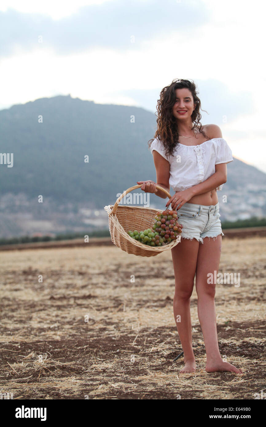 Young teen girl during harvest Model release available Stock Photo