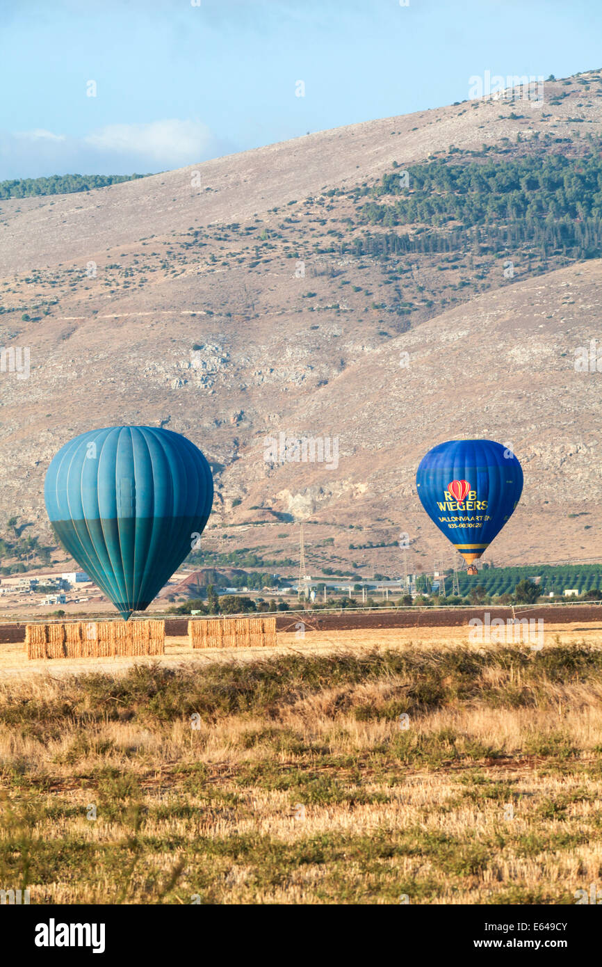 Hot air balloons photographed in the Jezreel Valley, Israel Mount Gilboa in the background Stock Photo