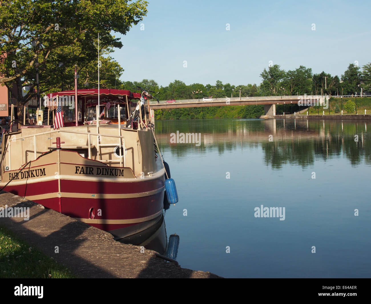 The Fair Dinkum moored along an embankment of Cayuga-Seneca Canal, Seneca Falls, NY, USA, June 15, 2014, © Katharine Andriotis Stock Photo