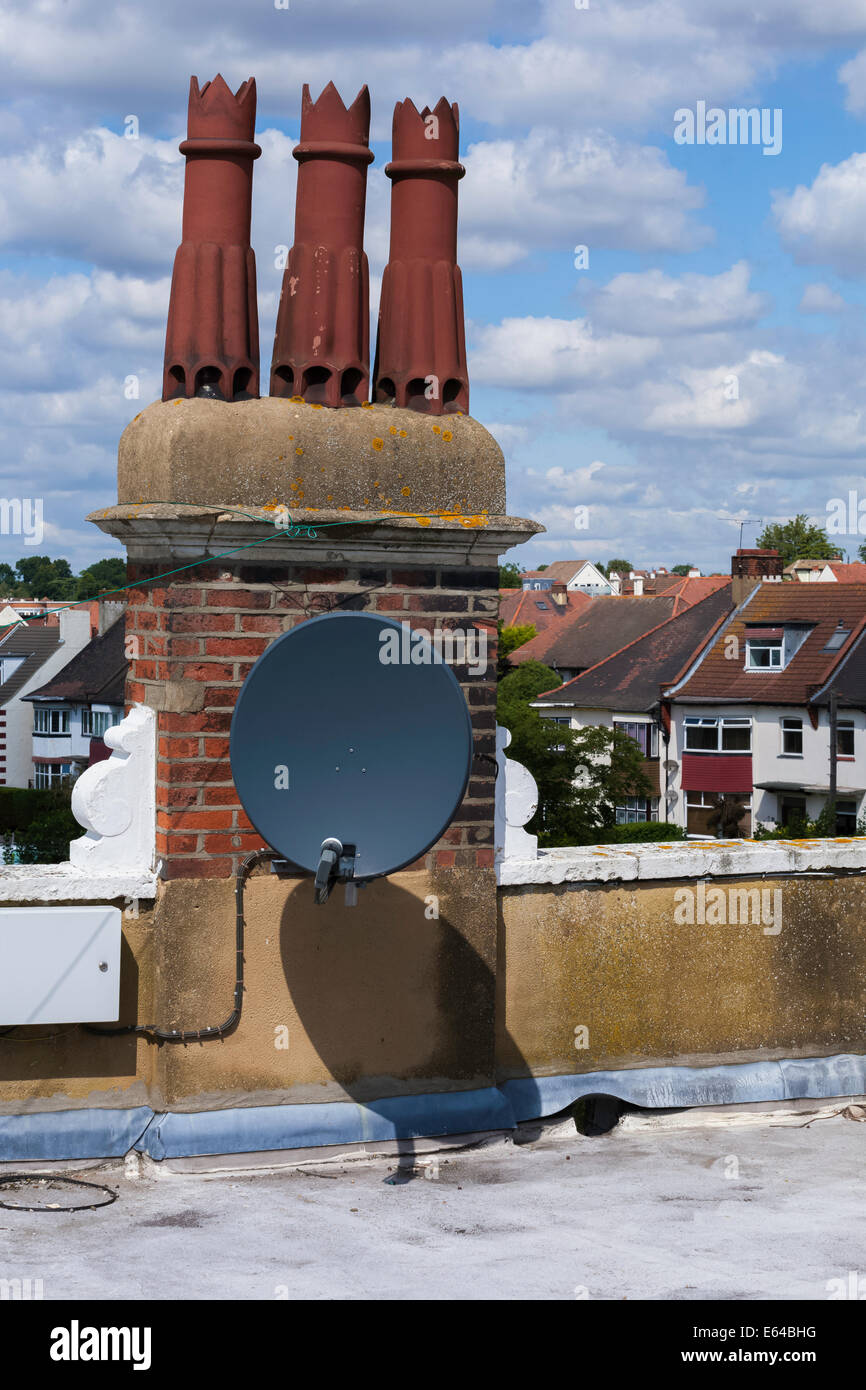 Chimney Stack and TV Satellite Dish Stock Photo