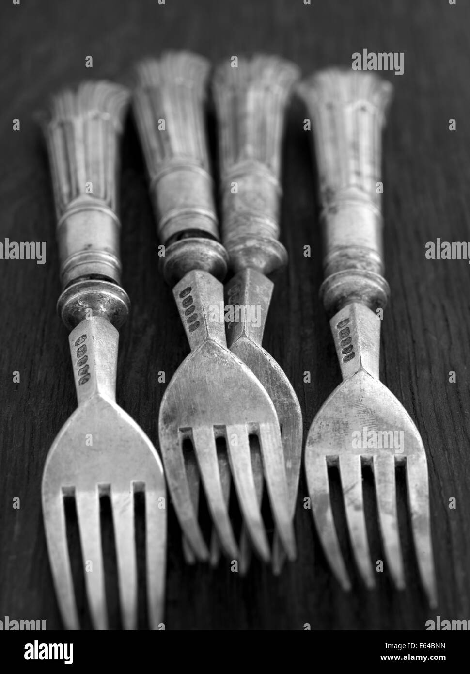 Old Vintage Table Forks on a dark background Stock Photo