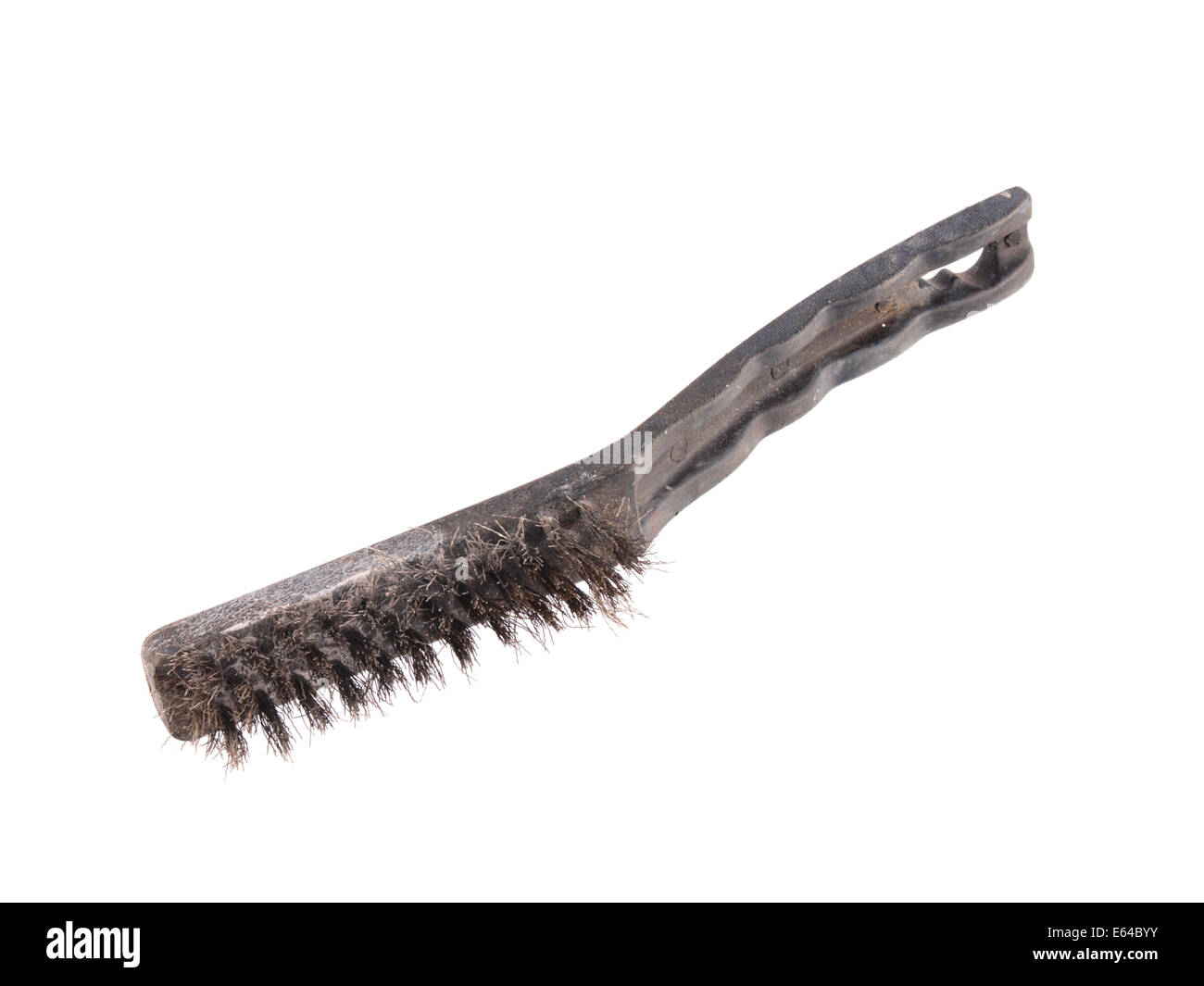 Close up photo of a wire brush on a plain white background. Stock Photo