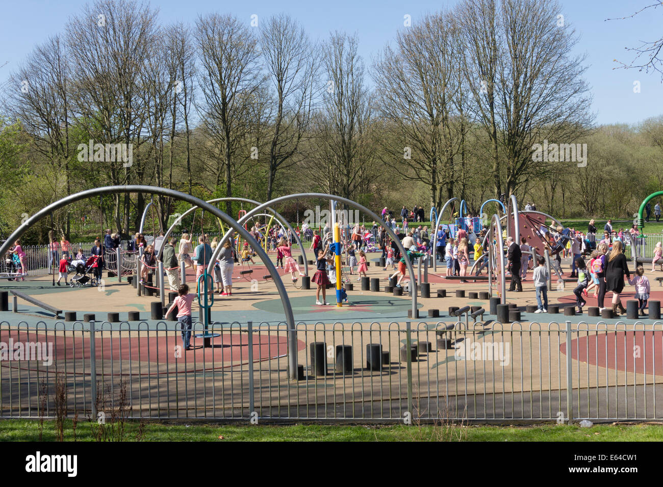 Many children playing in the playground area, the largest in Bolton borough, at Moses Gate Country Park, Farnworth. Stock Photo