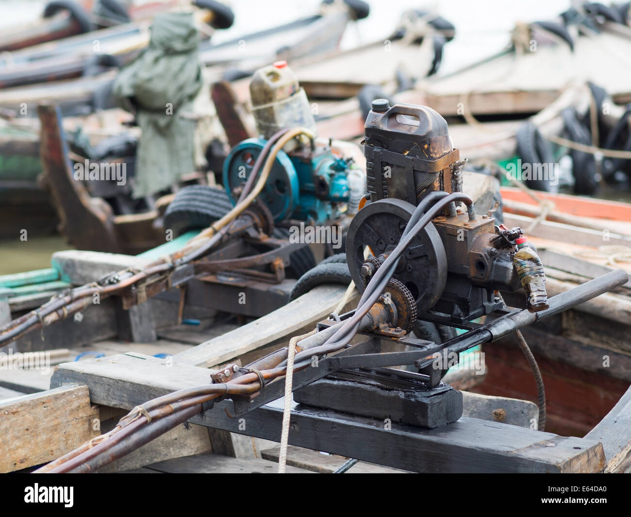 Primitive boat engines on traditional wooden boats at the harbour of