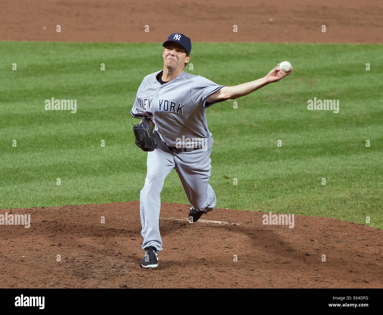 Fly Out To End The Inning. 11th Aug, 2014. New York Yankees pitcher Rich Hill (57) works in the