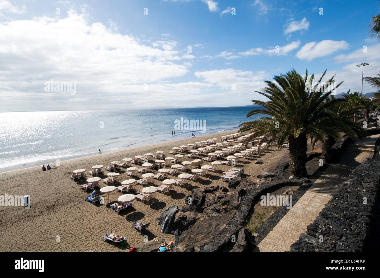 playa grande Lanzarote beach beaches sun lounger loungers sunlounger sunloungers sun bathing sunbathers sunbathe bathe sand sand Stock Photo
