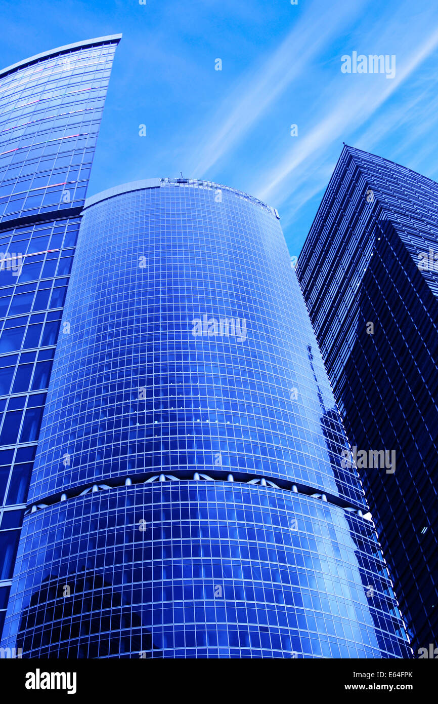 Modern skyscrapers close-up under blue sky with clouds Stock Photo - Alamy