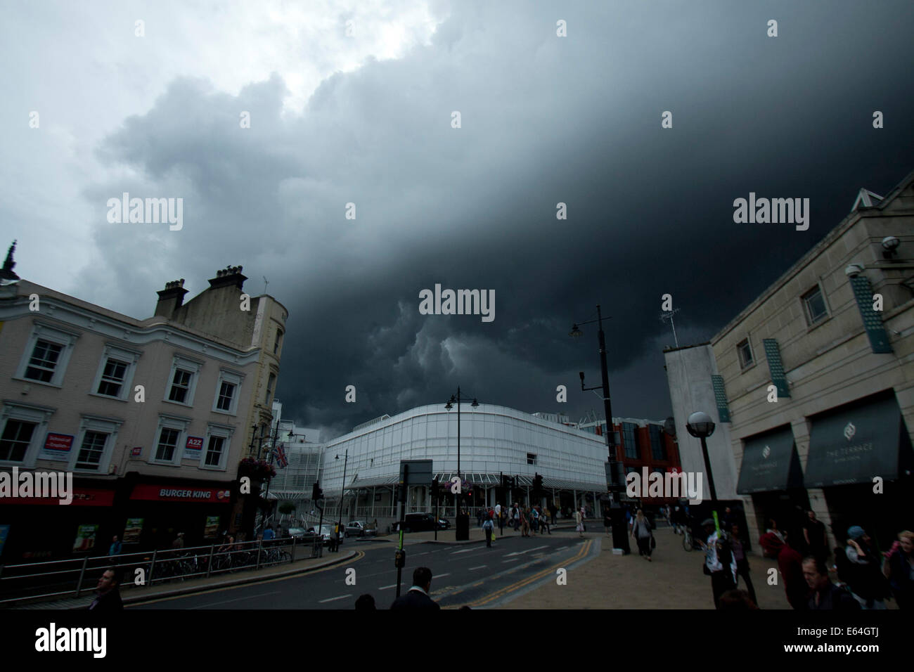 Wimbledon London,UK. 14th August 2014. Weather Pedestrians walk under