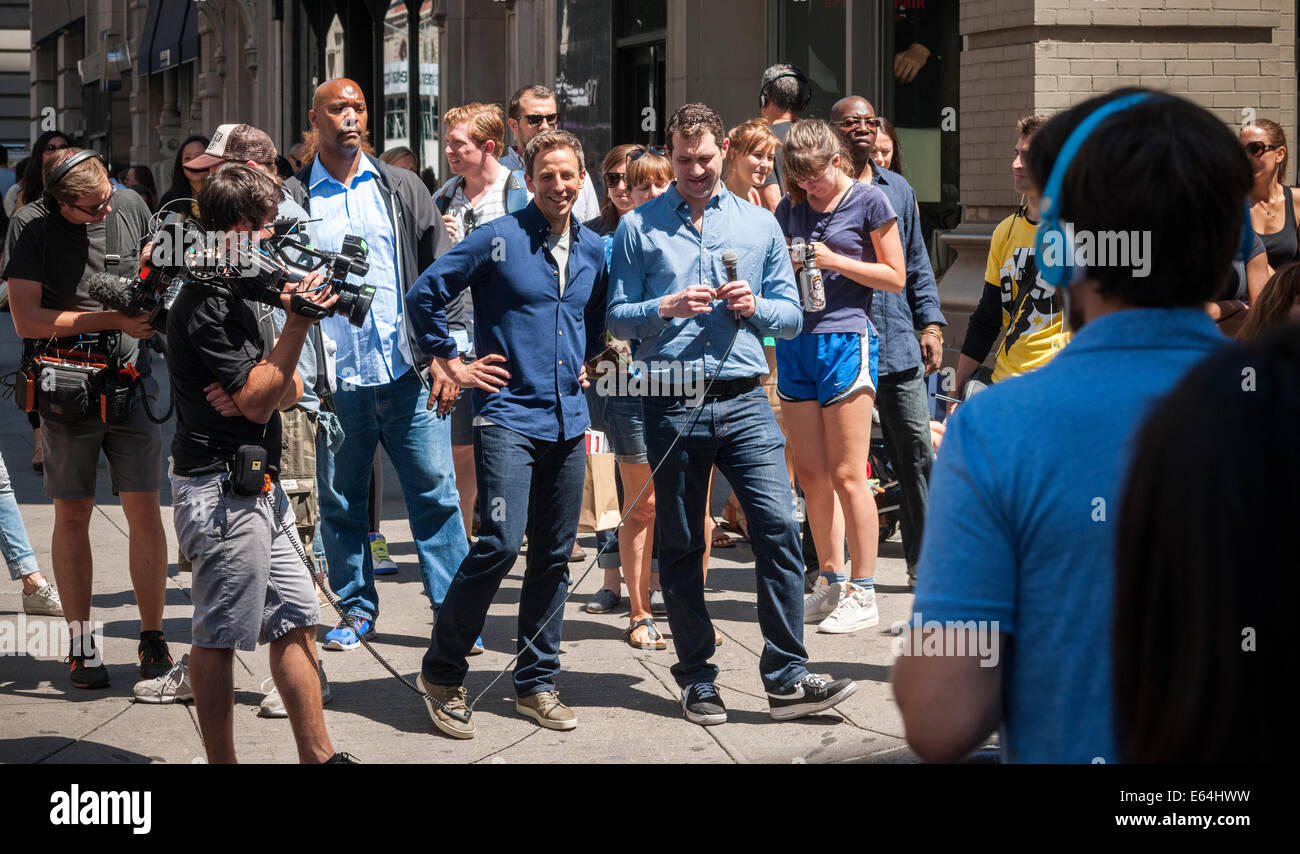 New York, US. 14th Aug, 2014. Seth Meyers, center, host of Late Night with Seth Meyers on NBC walks down Fifth Avenue in the Flatiron neighborhood in New York on Thursday, August 14, 2014 during the taping of a segment for his television program. Credit:  Richard Levine/Alamy Live News Stock Photo